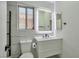 A modern bathroom featuring a sleek vanity and an illuminated mirror at 8404 Shore Breeze Dr, Las Vegas, NV 89128