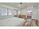 A serene bedroom featuring wood flooring, dresser, and a bay window at 8404 Shore Breeze Dr, Las Vegas, NV 89128