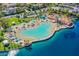 Aerial view of the community pool, featuring a sandy beach entry and surrounding palm trees at 8404 Shore Breeze Dr, Las Vegas, NV 89128