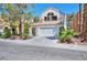 Charming two-story home featuring a well-maintained front yard and a spacious two-car garage at 8404 Shore Breeze Dr, Las Vegas, NV 89128