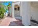 Charming front entrance with brick-paved walkway and stucco architecture at 8404 Shore Breeze Dr, Las Vegas, NV 89128