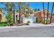 Well-maintained home with lush landscaping and a spacious two-car garage at 8404 Shore Breeze Dr, Las Vegas, NV 89128