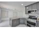Kitchen featuring a gas range, stainless steel appliances and granite counters at 8404 Shore Breeze Dr, Las Vegas, NV 89128