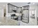 Updated kitchen with stainless steel appliances and granite countertops at 8404 Shore Breeze Dr, Las Vegas, NV 89128