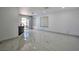 Open-concept living area with marble floors and natural light at 8404 Shore Breeze Dr, Las Vegas, NV 89128