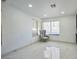 Bright room with tiled floors, large window and comfortable chair at 8404 Shore Breeze Dr, Las Vegas, NV 89128