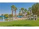 Picturesque park featuring a sandy beach, swimming area, and picnic spots surrounded by lush greenery at 8404 Shore Breeze Dr, Las Vegas, NV 89128