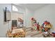 Playroom with wood floors and vaulted ceiling, chalkboard, toys, and natural light at 8404 Shore Breeze Dr, Las Vegas, NV 89128