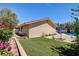 Home featuring a well-manicured lawn, perfect for relaxing and enjoying the outdoors at 8705 Orvieto Dr, Las Vegas, NV 89117