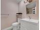 Bathroom featuring a toilet, a single sink vanity and a shower with glass doors at 8705 Orvieto Dr, Las Vegas, NV 89117