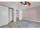 Bedroom featuring a ceiling fan, an closet with shelving and access to another room at 8705 Orvieto Dr, Las Vegas, NV 89117