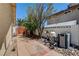 Side yard view of pool equipment and well kept area, featuring block wall at 8705 Orvieto Dr, Las Vegas, NV 89117