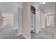 Hallway featuring a built in shelving and access to various rooms at 8705 Orvieto Dr, Las Vegas, NV 89117