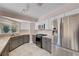 Bright kitchen featuring stainless steel appliances, butcher block countertops, and light gray cabinets at 8705 Orvieto Dr, Las Vegas, NV 89117
