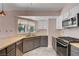 Updated kitchen featuring stainless steel appliances, gray cabinets, and butcher block countertops at 8705 Orvieto Dr, Las Vegas, NV 89117