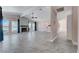 Spacious living room with a stone fireplace and large windows at 8705 Orvieto Dr, Las Vegas, NV 89117