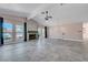 Spacious living room with fireplace, large windows and stone-look tile flooring at 8705 Orvieto Dr, Las Vegas, NV 89117
