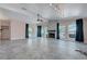 Spacious living room features stone-look tile flooring and a tiled fireplace at 8705 Orvieto Dr, Las Vegas, NV 89117