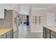 Open floor plan showcasing kitchen with bar seating and views of the backyard at 8705 Orvieto Dr, Las Vegas, NV 89117