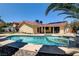 Inviting backyard pool with spa and covered patio, perfect for outdoor entertaining at 8705 Orvieto Dr, Las Vegas, NV 89117