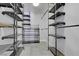 Walk-in closet provides ample storage space with shelving and rods for clothing at 8705 Orvieto Dr, Las Vegas, NV 89117