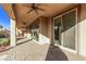 Covered back patio with brick flooring and sliding glass doors at 8797 Pinley Spring St, Las Vegas, NV 89113
