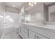 Bright bathroom with dual sinks, granite countertops, and bath-shower combo at 8797 Pinley Spring St, Las Vegas, NV 89113