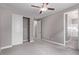 Bedroom featuring a ceiling fan, closet, and access to bathroom at 8797 Pinley Spring St, Las Vegas, NV 89113