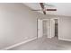 Comfortable bedroom featuring a ceiling fan and doorways leading to other rooms at 8797 Pinley Spring St, Las Vegas, NV 89113