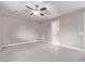 Neutral bedroom featuring carpet flooring, a ceiling fan, light gray walls, and white trim at 8797 Pinley Spring St, Las Vegas, NV 89113