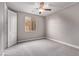 Neutral bedroom featuring a ceiling fan and lots of natural light at 8797 Pinley Spring St, Las Vegas, NV 89113