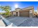 Charming single-story home featuring a well-manicured yard, two-car garage, and paver driveway at 8797 Pinley Spring St, Las Vegas, NV 89113