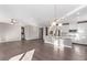 Open concept floorplan featuring a kitchen island, stainless steel appliances, and hardwood floors at 8797 Pinley Spring St, Las Vegas, NV 89113