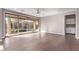 Open living space featuring sliding glass doors, hardwood floors, and a ceiling fan at 8797 Pinley Spring St, Las Vegas, NV 89113