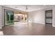 Open living space featuring sliding glass doors, hardwood floors, and a ceiling fan at 8797 Pinley Spring St, Las Vegas, NV 89113