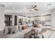 Spacious living room featuring modern furnishings and lots of natural light from surrounding windows at 8797 Pinley Spring St, Las Vegas, NV 89113