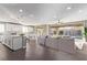 Bright, open-concept living space with hardwood floors, recessed lighting and backyard view at 8797 Pinley Spring St, Las Vegas, NV 89113