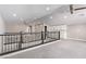 Large loft space features a ceiling fan, railing, wet bar, and access to other rooms at 8797 Pinley Spring St, Las Vegas, NV 89113