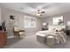 The main bedroom features carpeted floors, a ceiling fan, and plantation shutters at 8797 Pinley Spring St, Las Vegas, NV 89113