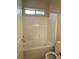 Bright bathroom features white tiled shower and natural light from window at 9138 Hermosa Valley St, Las Vegas, NV 89178