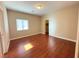 Bedroom with hardwood floors, natural lighting from window, and white trim at 9138 Hermosa Valley St, Las Vegas, NV 89178