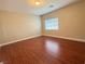 Bedroom with hardwood floors, neutral colored walls, white trim and natural lighting at 9138 Hermosa Valley St, Las Vegas, NV 89178