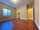 Sunlit bedroom with hardwood floors, a closet, and a window with blinds at 9138 Hermosa Valley St, Las Vegas, NV 89178