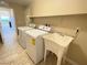 Laundry area with a sink and washer/dryer hookups at 9138 Hermosa Valley St, Las Vegas, NV 89178