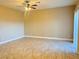 Spacious living room featuring tile flooring, ceiling fan, and neutral color palette at 9138 Hermosa Valley St, Las Vegas, NV 89178