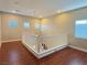 Open loft area with hardwood floors and natural lighting from multiple windows at 9138 Hermosa Valley St, Las Vegas, NV 89178