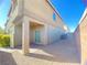 Back yard featuring a covered patio, gravel landscaping, and privacy wall at 9138 Hermosa Valley St, Las Vegas, NV 89178
