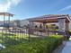 Community playground and picnic area with a covered structure at 9138 Hermosa Valley St, Las Vegas, NV 89178