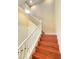 A wooden staircase with white railing at 9138 Hermosa Valley St, Las Vegas, NV 89178