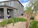 Landscaped backyard with desert landscaping, gravel, and a covered patio perfect for relaxing and outdoor living at 929 Hunter Shores Ave, North Las Vegas, NV 89084